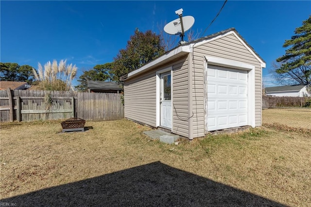 garage featuring a yard