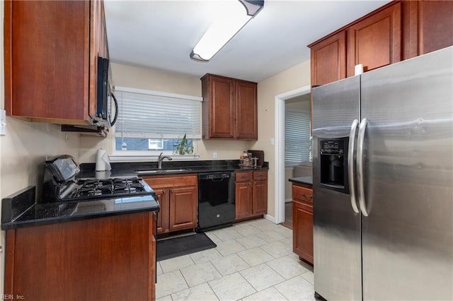 kitchen with sink, range, stainless steel fridge, dishwasher, and dark stone counters