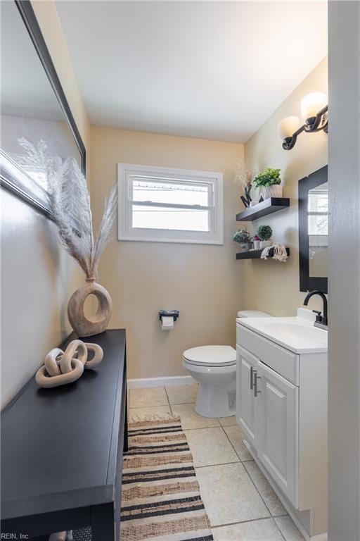 bathroom featuring tile patterned floors, toilet, and vanity