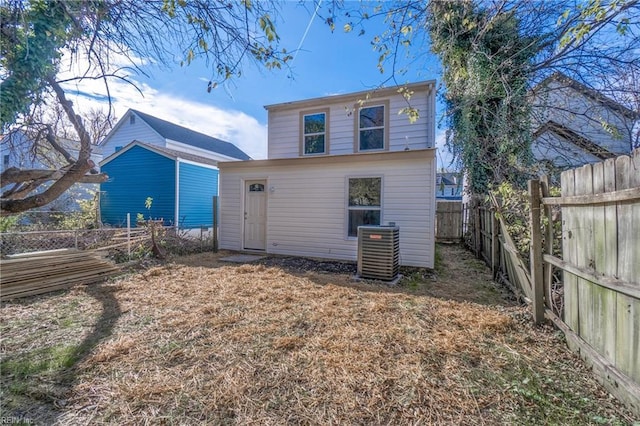 back of house featuring central AC unit