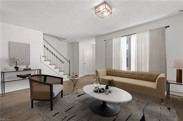 living room with dark hardwood / wood-style flooring