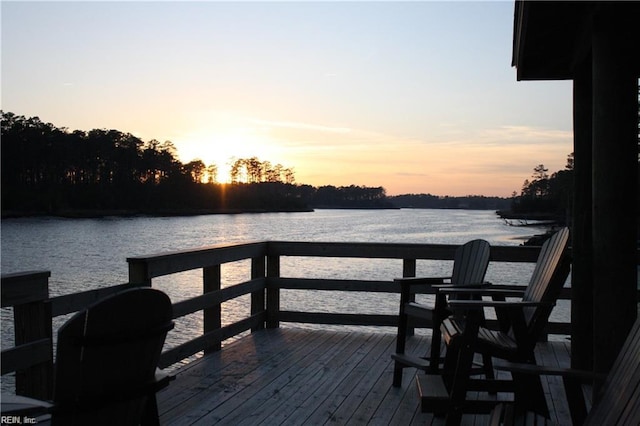 view of dock featuring a deck with water view