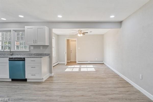 kitchen with white cabinetry, a baseboard heating unit, stainless steel dishwasher, and light wood-type flooring