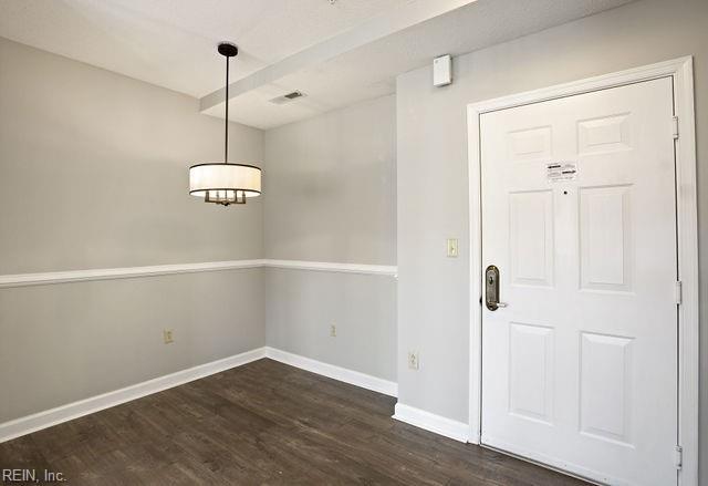 entrance foyer featuring dark hardwood / wood-style flooring