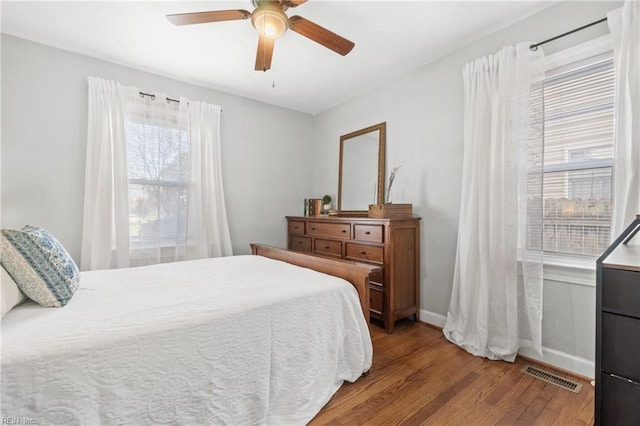 bedroom with ceiling fan and light wood-type flooring