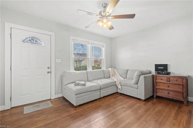 living room with hardwood / wood-style floors and ceiling fan