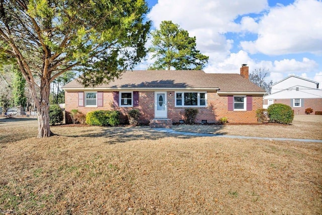 ranch-style home with a front lawn