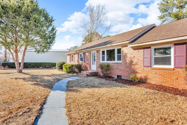 ranch-style home featuring a front yard