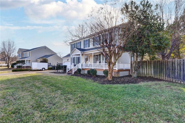 view of front of home with a porch and a front yard