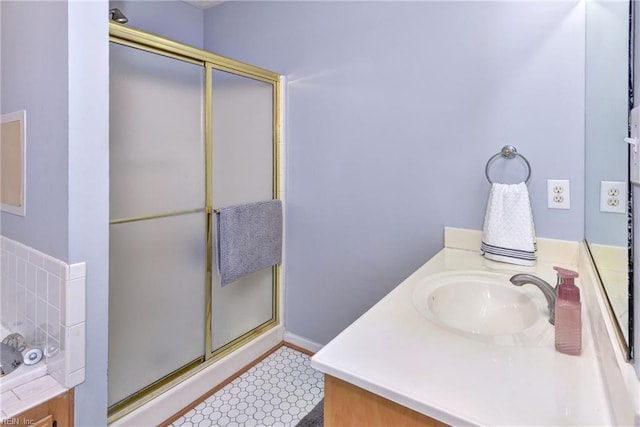 bathroom with vanity and an enclosed shower