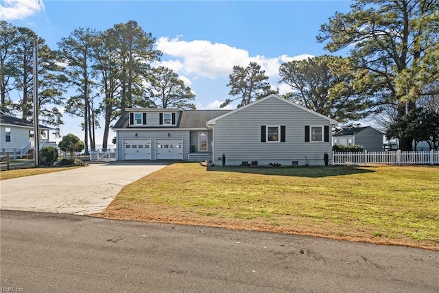 view of front of house featuring a garage and a front lawn