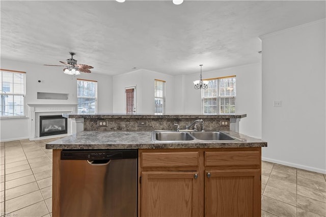 kitchen with dishwasher, sink, a kitchen island with sink, and a healthy amount of sunlight