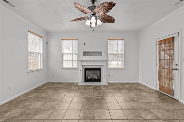 unfurnished living room featuring light tile patterned floors, crown molding, plenty of natural light, and ceiling fan