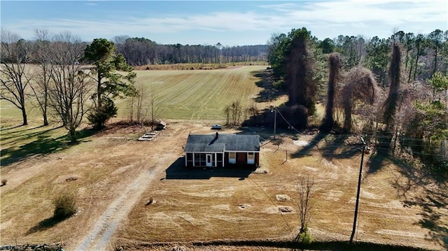 birds eye view of property with a rural view