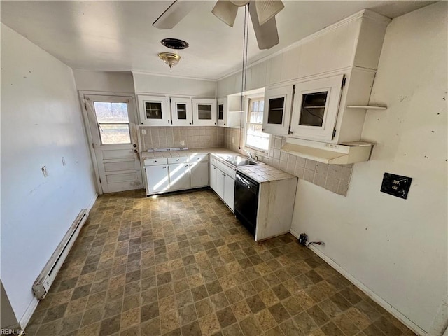 kitchen featuring sink, dishwasher, ceiling fan, white cabinetry, and a baseboard heating unit