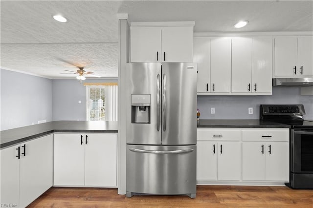 kitchen with hardwood / wood-style flooring, ceiling fan, stainless steel appliances, white cabinets, and a textured ceiling