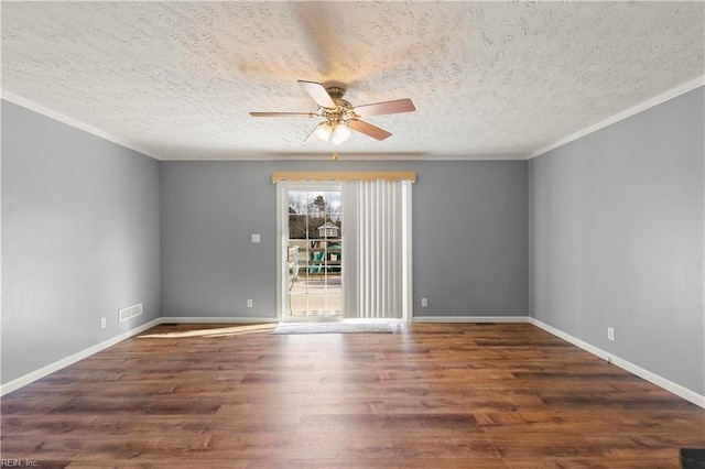 empty room featuring ceiling fan, crown molding, dark hardwood / wood-style floors, and a textured ceiling