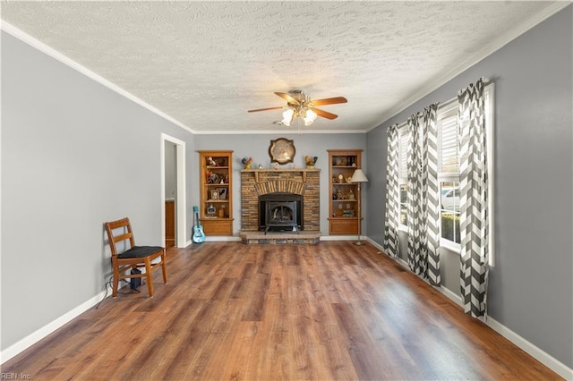 unfurnished living room with ornamental molding, wood-type flooring, and a textured ceiling