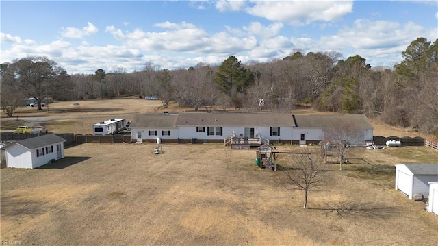 exterior space featuring a deck and a storage unit