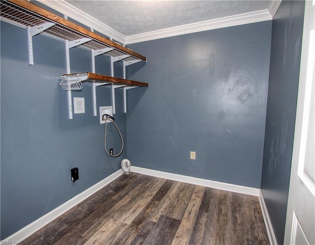 clothes washing area featuring washer hookup, crown molding, dark hardwood / wood-style floors, and a textured ceiling