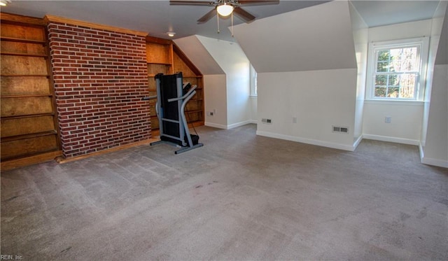 additional living space with lofted ceiling, carpet flooring, and ceiling fan