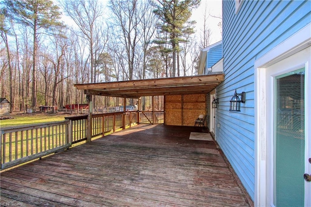 wooden terrace with a yard