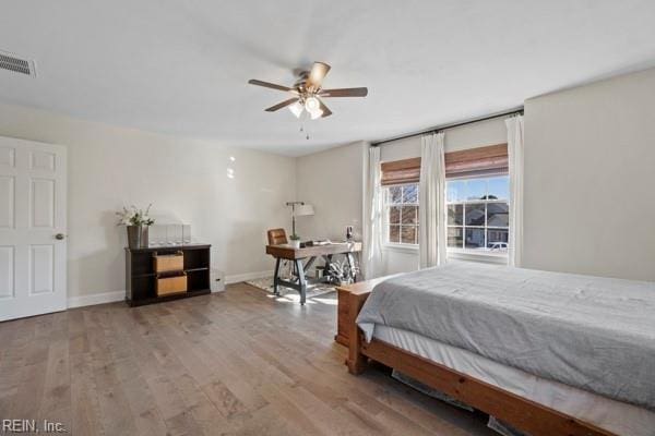 bedroom featuring hardwood / wood-style flooring and ceiling fan