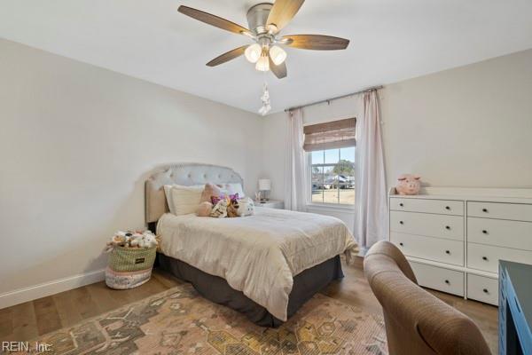 bedroom featuring hardwood / wood-style flooring and ceiling fan