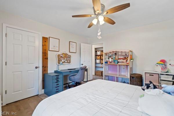 bedroom featuring wood-type flooring and ceiling fan