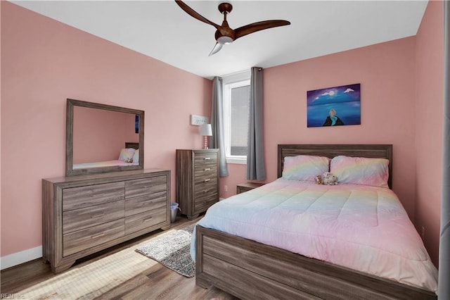 bedroom featuring wood-type flooring and ceiling fan