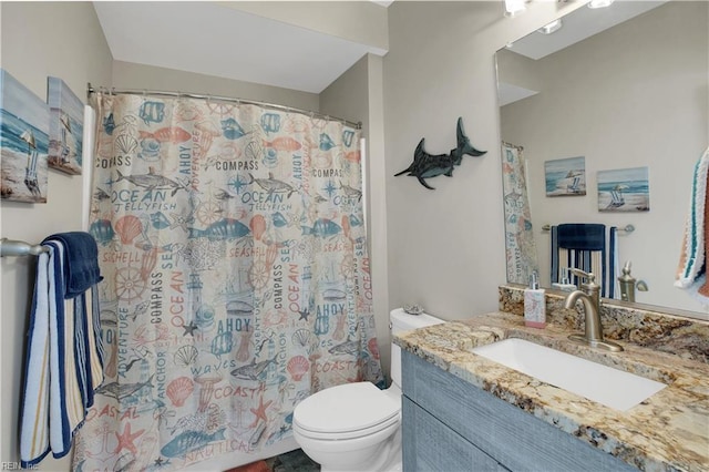 bathroom with vanity, a shower with curtain, and toilet