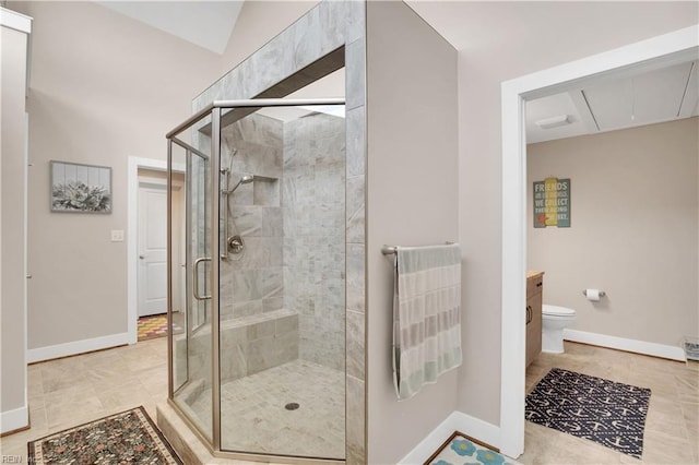 bathroom with vanity, tile patterned flooring, a shower with shower door, and toilet