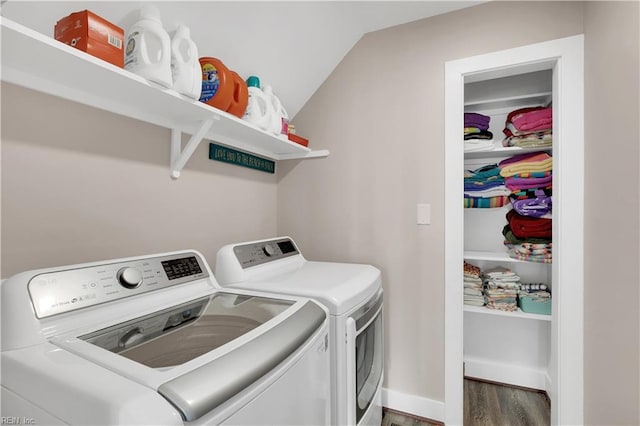 washroom featuring dark hardwood / wood-style flooring and separate washer and dryer