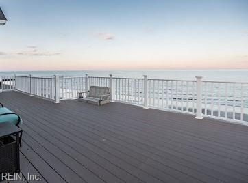 deck at dusk with a water view