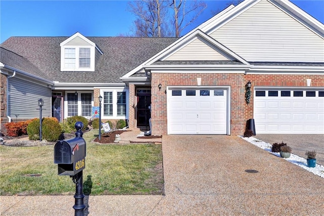 view of front of house with a garage and a front yard