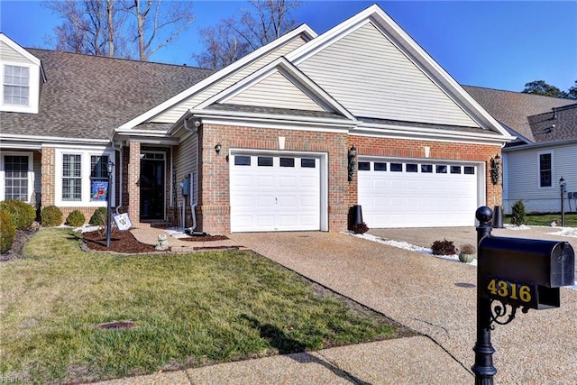 view of front of home with a garage and a front lawn