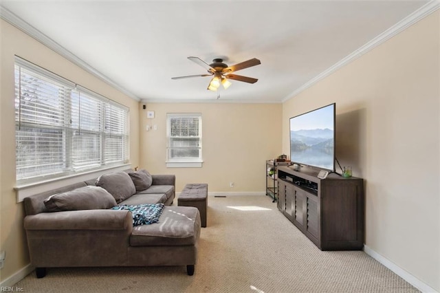 carpeted living room with ornamental molding and ceiling fan