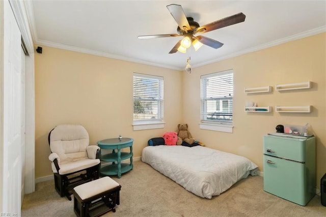 bedroom featuring crown molding, carpet floors, and ceiling fan