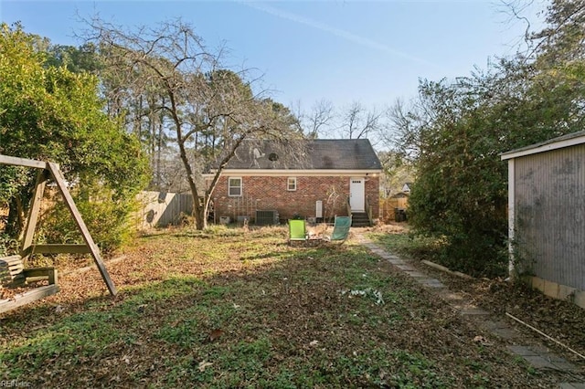 rear view of property featuring central air condition unit