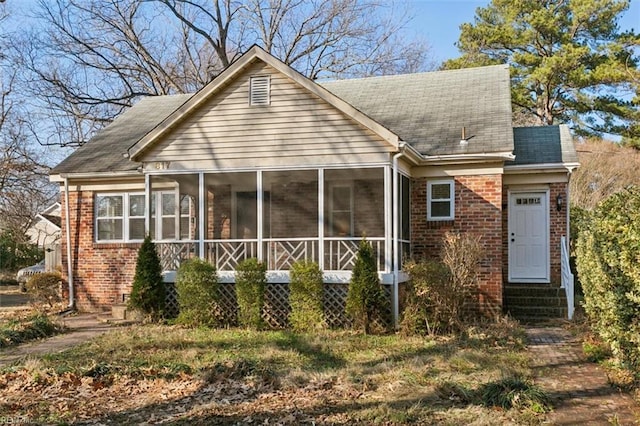 view of front of property with a sunroom