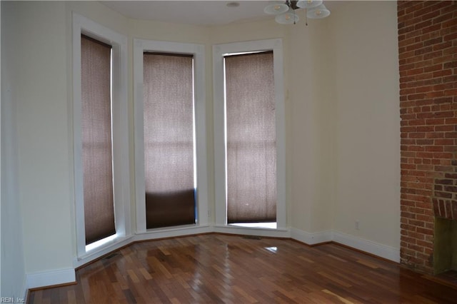 spare room with dark hardwood / wood-style floors