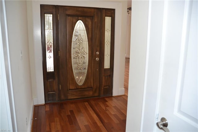 interior space with dark hardwood / wood-style flooring