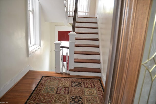 stairway featuring hardwood / wood-style floors