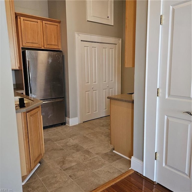 kitchen featuring stainless steel refrigerator