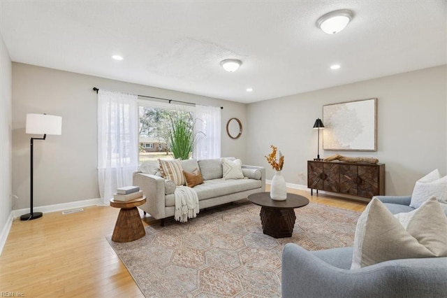 living room with light hardwood / wood-style floors