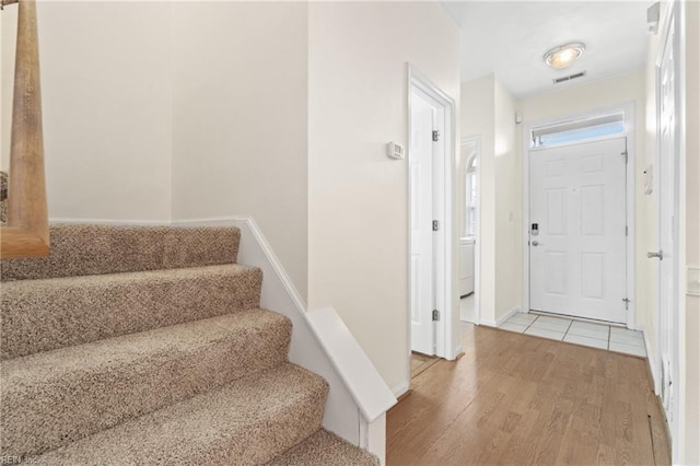 entryway with light hardwood / wood-style flooring