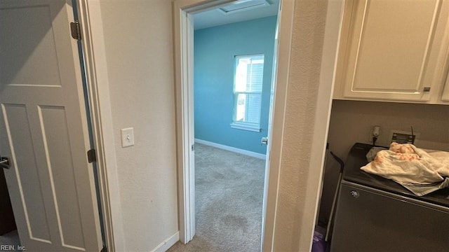 hallway featuring light carpet