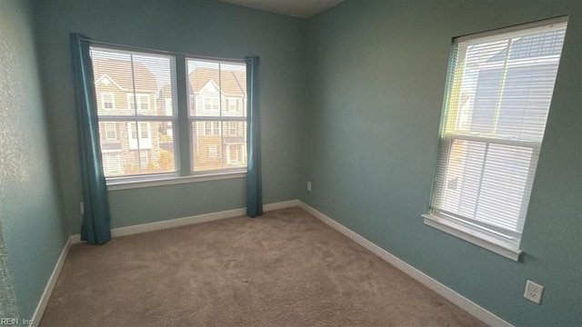 empty room featuring carpet flooring