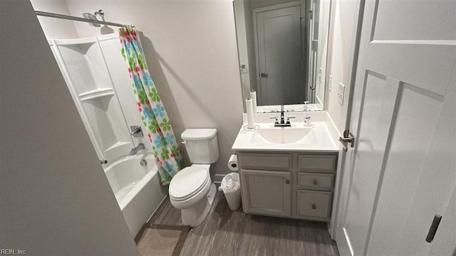 full bathroom featuring vanity, wood-type flooring, shower / bath combination with curtain, and toilet