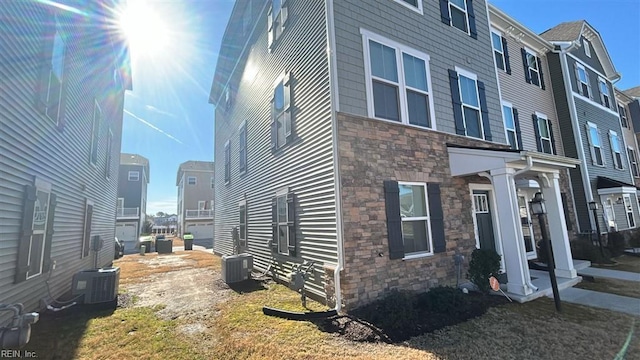 view of home's exterior with cooling unit